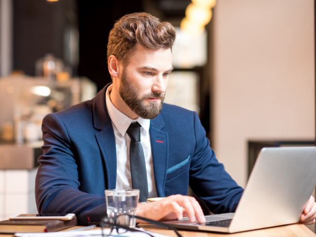 Man Typing at Computer