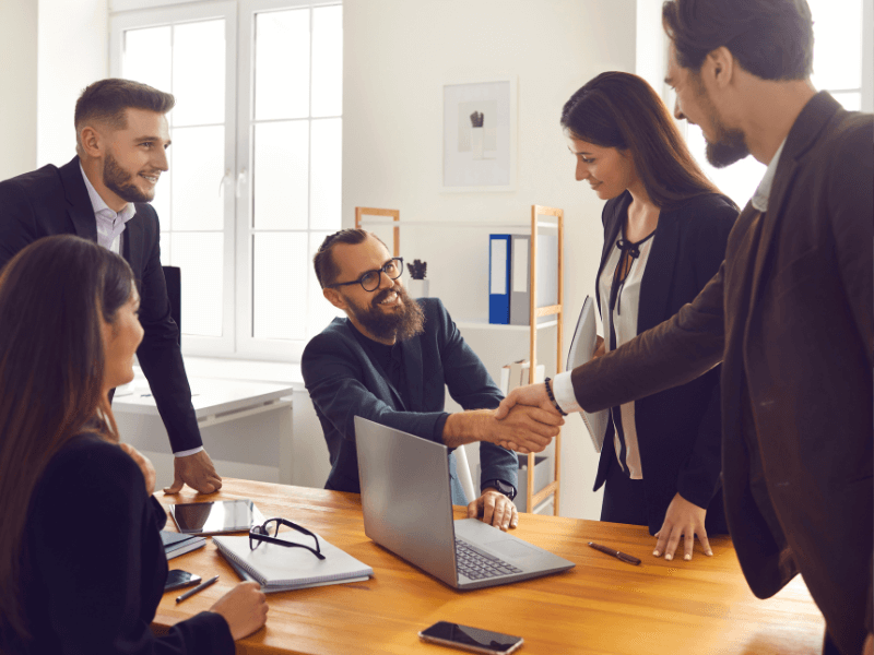 Business partners talking around table