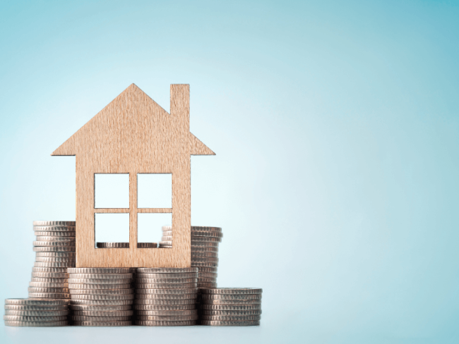 Picture of a house on top of coins
