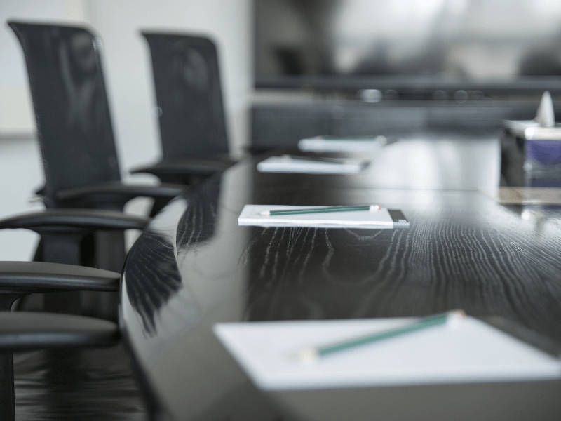 Picture of a Conference Room with Notepads & Pencils