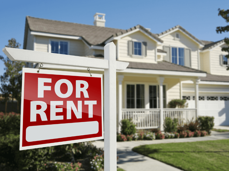Picture of a Home with a For Rent Sign In the Yard
